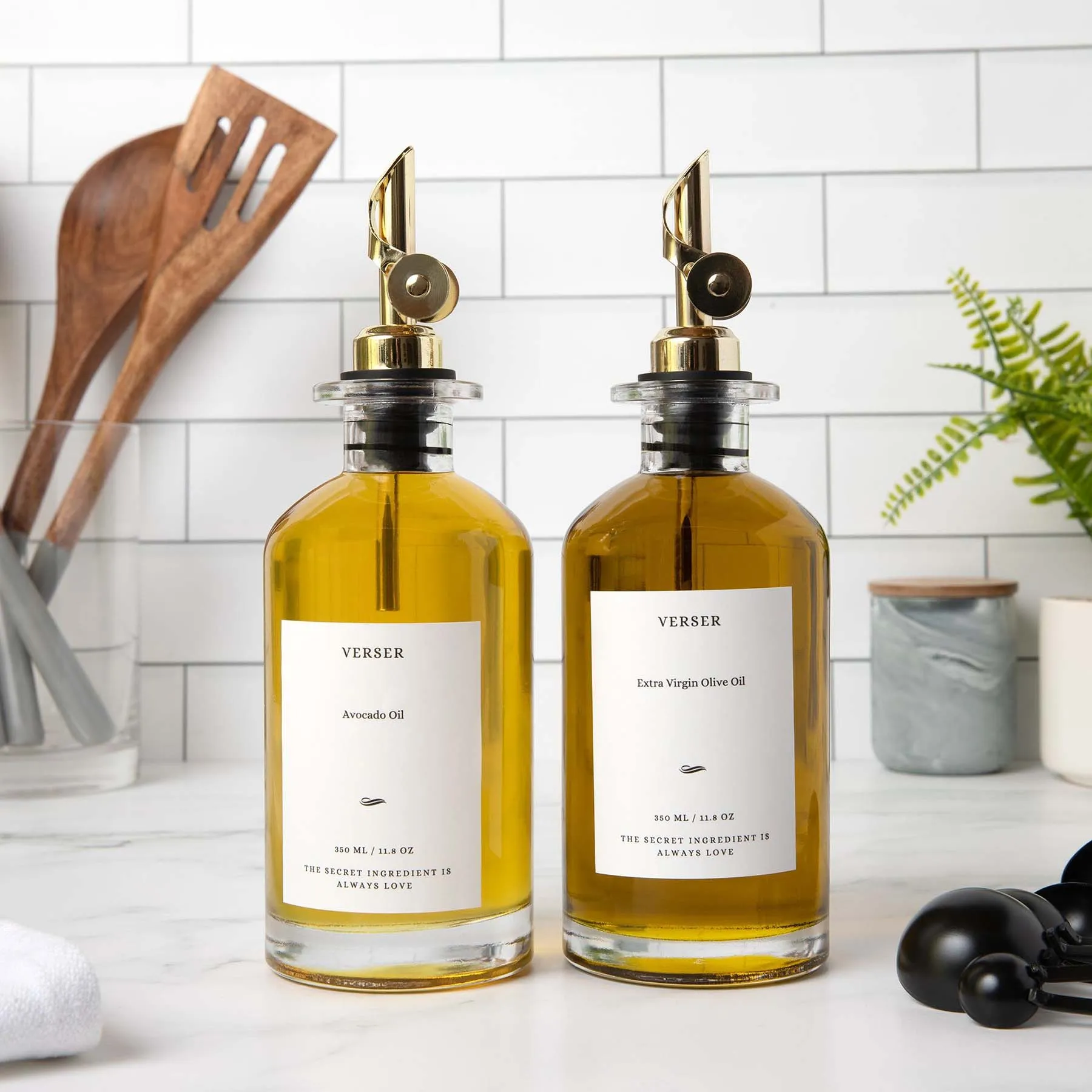 olive oil in a glass jar on a kitchen counter